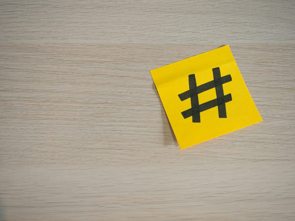 a yellow piece of paper with a hash symbol on it